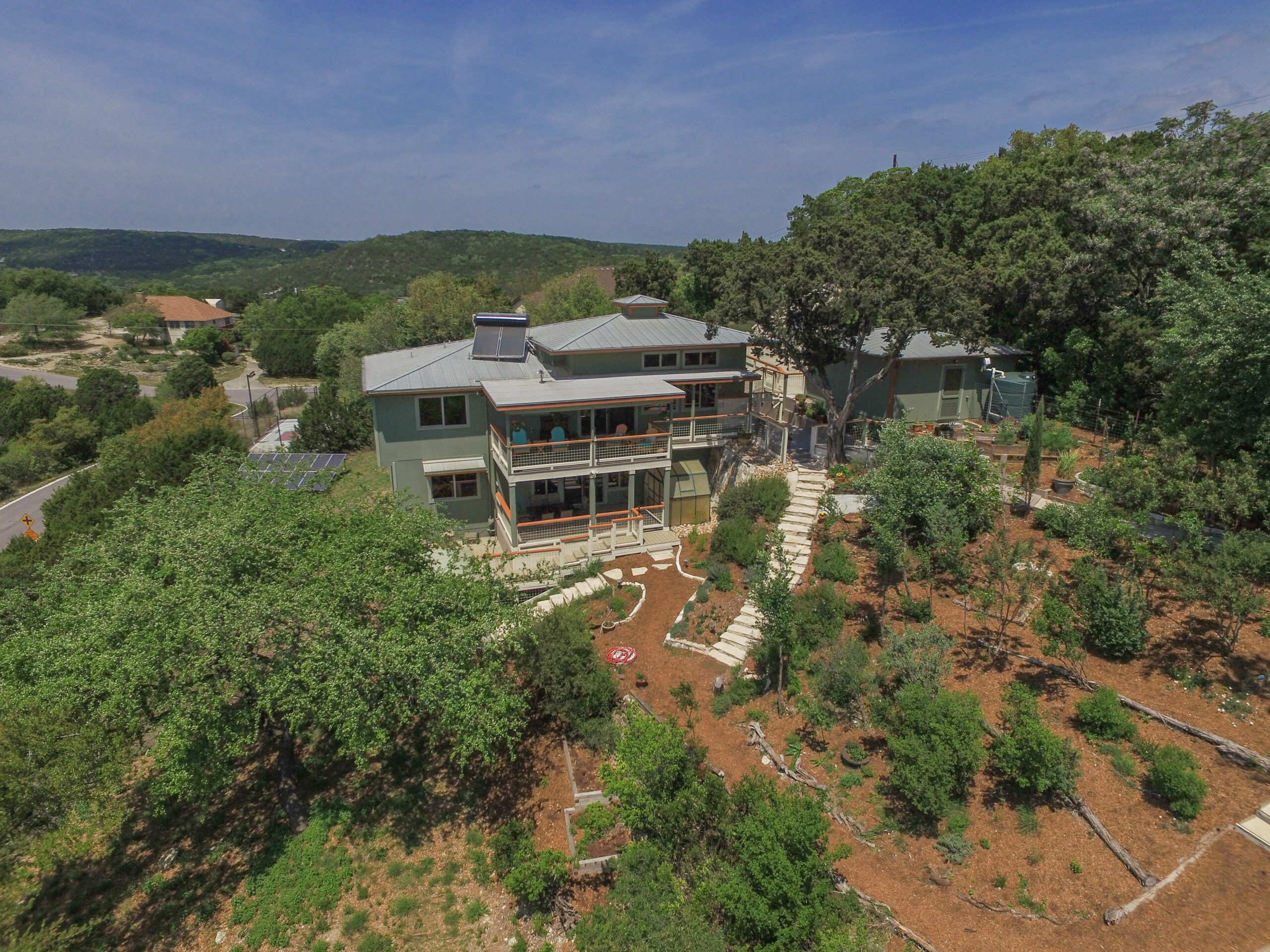 Aerial view of a Central Texas organic home and landscape